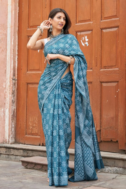 Green mulmul cotton saree with stunning hand block designs.