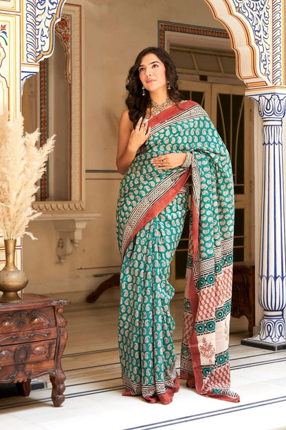 Green mulmul cotton saree with stunning hand block designs.