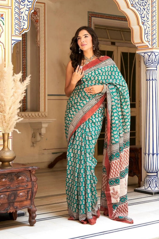 Green mulmul cotton saree with stunning hand block designs.