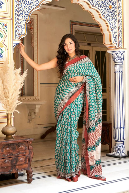 Green mulmul cotton saree with stunning hand block designs.