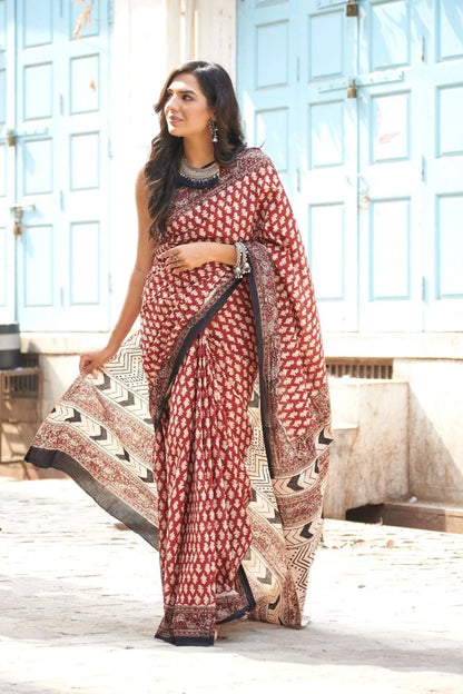 Hot red mulmul cotton saree with artistic block prints.