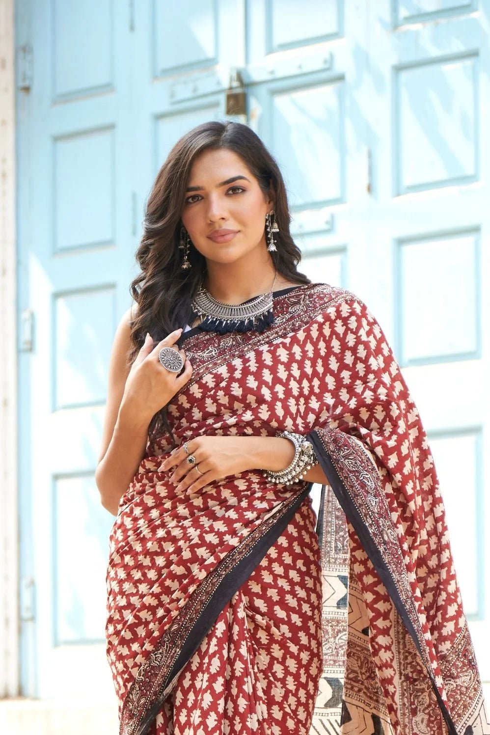 Hot red mulmul cotton saree with artistic block prints.