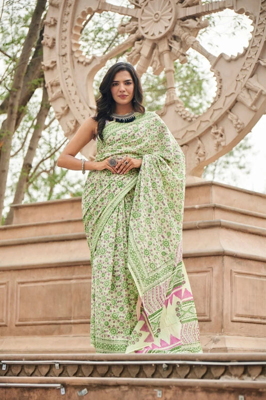 Light green mulmul cotton saree with detailed hand block motifs.
