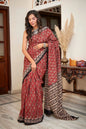 Maroon mulmul cotton saree with intricate hand block patterns.