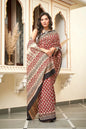 Red mulmul cotton saree with heart print designs.
