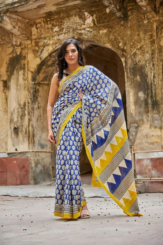 Royal blue and yellow mulmul cotton saree with artistic prints.