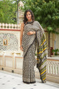 Black mulmul cotton saree with intricate booti print.