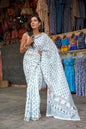 White mulmul cotton saree with intricate block printing.