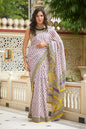 White and purple mulmul cotton saree with artistic block prints.