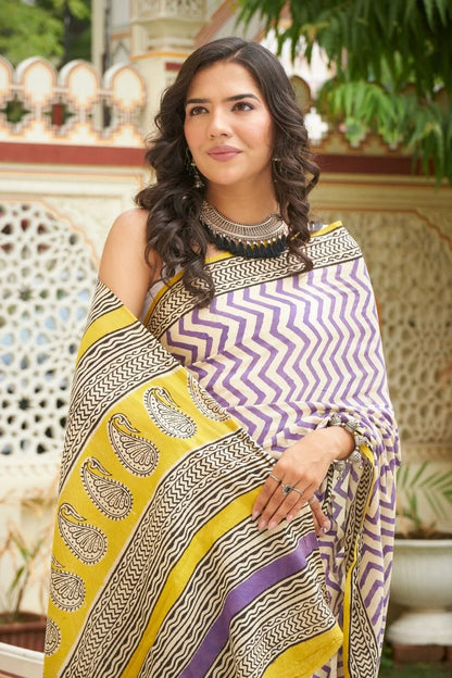 White and purple mulmul cotton saree with artistic block prints.