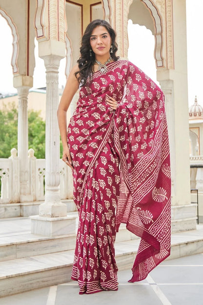 Wine red mulmul cotton saree with delicate hand block work.