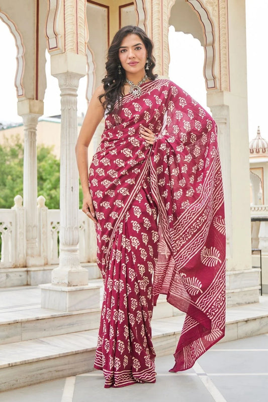 Wine red mulmul cotton saree with delicate hand block work.