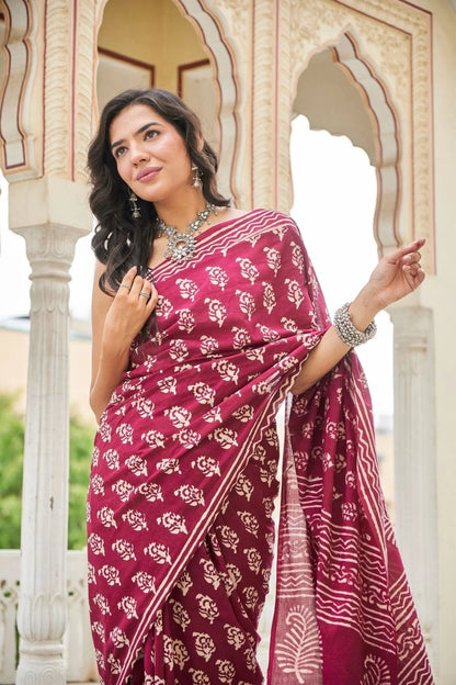 Wine red mulmul cotton saree with delicate hand block work.