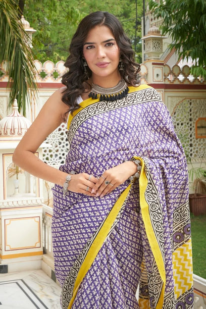Yellow and blue mulmul cotton saree with handcrafted block prints.