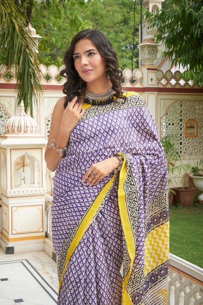 Yellow and blue mulmul cotton saree with handcrafted block prints.